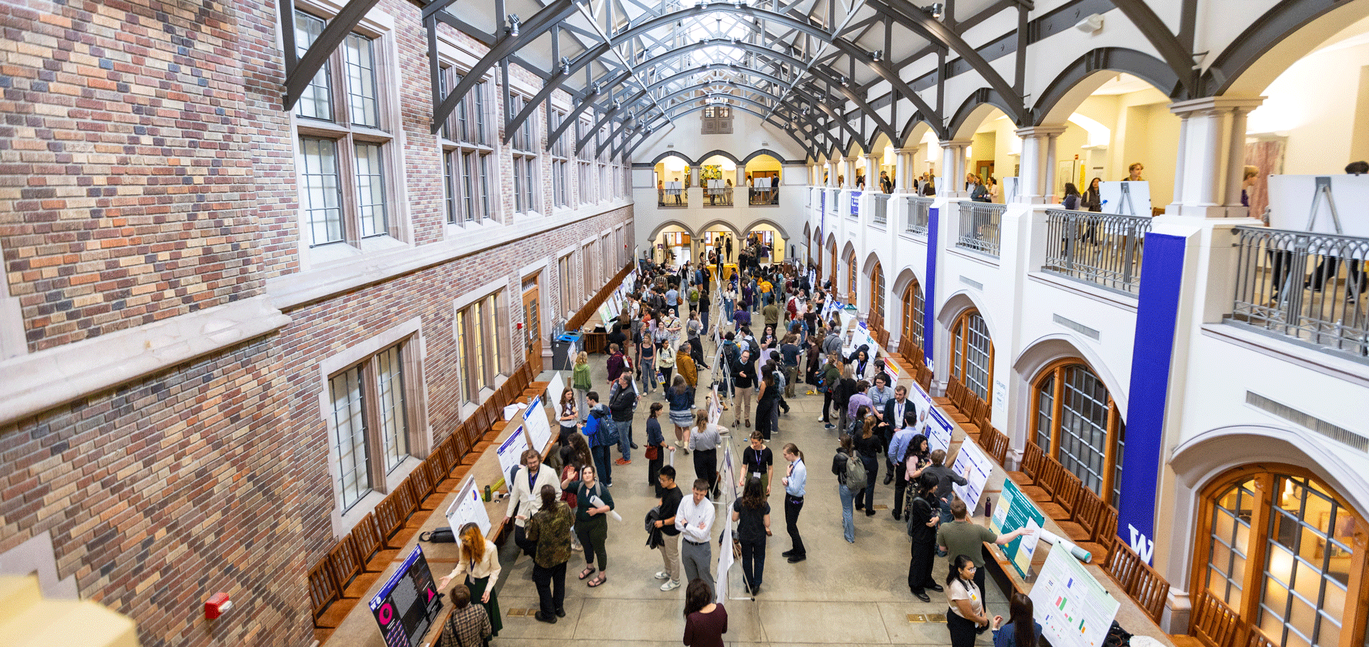 Wide view of people gathering in Mary Gates Hall.